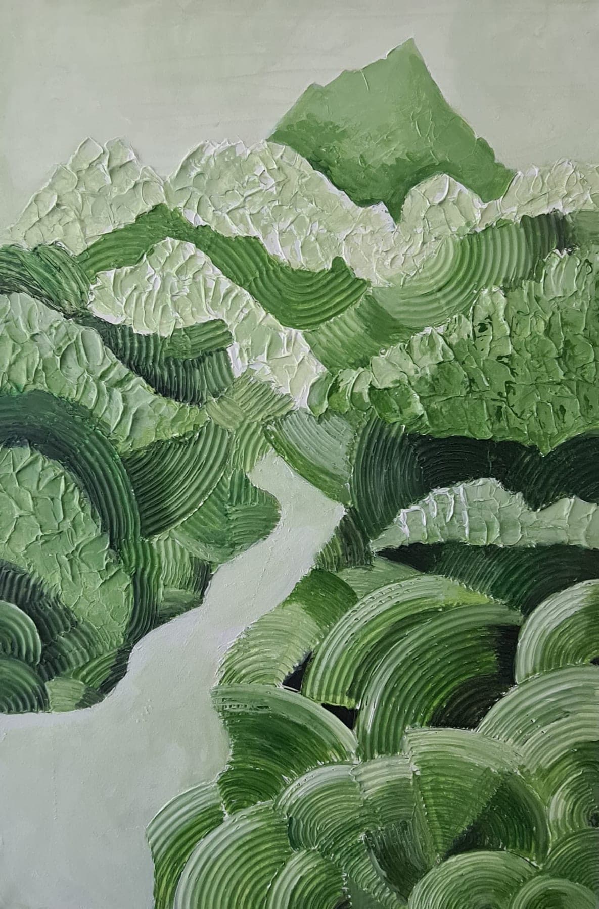 Deep relief work in shades of green — ridged, carved bands reading as hills and terraced fields, with a pale river winding down through the middle.