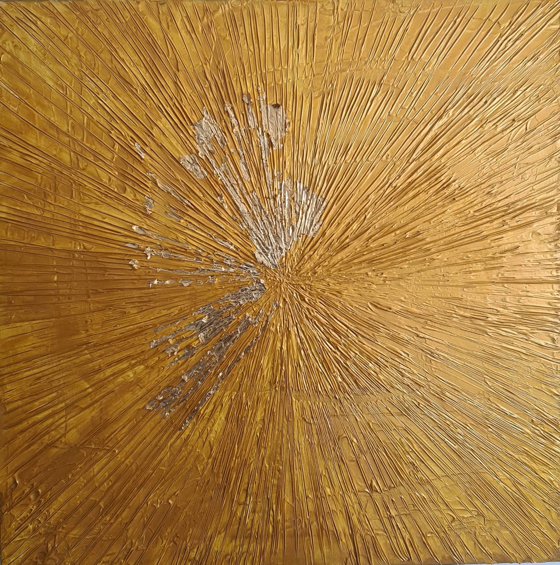 A square canvas worked entirely in gold, with fine raised lines radiating from a slightly off-centre point like a burst of light.